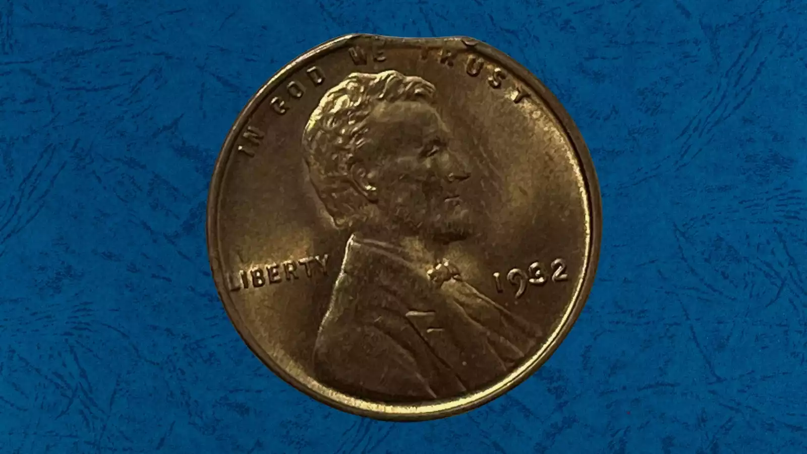 1932 wheat penny clipped planchet error showing curved crescent-shaped section missing from coin edge
